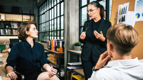 diverse colleagues collaborative brainstorming at office briefing business woman manager explaining analysis at the meeting startup work