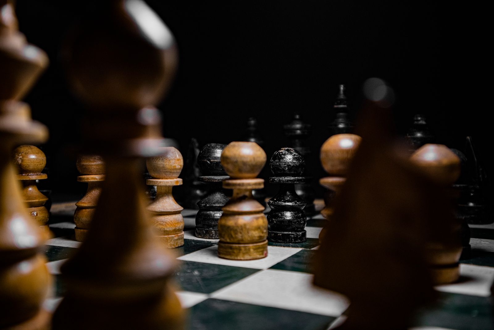 Chess pieces arranged on a chessboard mid-game